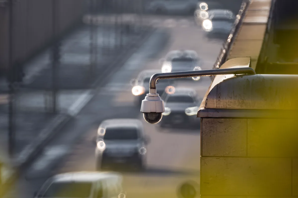 Traffic surveillance camera overlooking a busy roadway